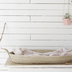 Olli Ella Reva baby changing basket styled with baby essentials